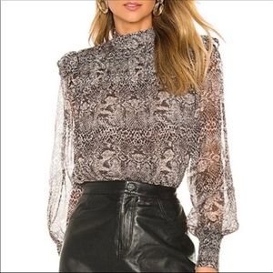 New We The Free snake print long sleeved blouse. Tie-neck back. No tags.